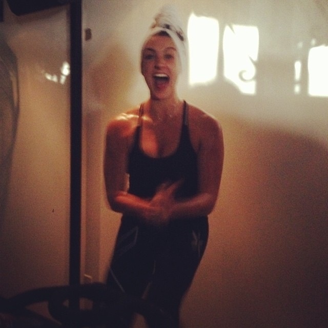 Nicole Sciacca, owner of Hustle & Flow Fitness, rocks a towel head wrap and exuberant smile during Endurance Ride. (Photo taken by fellow spinner)