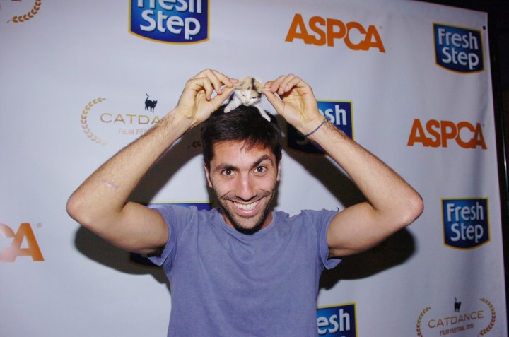 MTV’s Catfish Nev Schulman star cuddling with a Fresh Step & Catdance kitten to raise money the ASPCA! (photo: Milla Cochran)