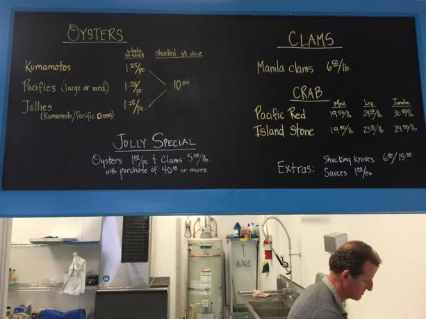 Jolly Oyster Market A chalkboard displays the day's offerings.