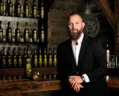 Sean Conley with Mama's Boy Infusion bottles.article