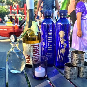 wind and water displayed on LACMA Cafe's Louis picnic basket set-up with table and blanket for LACMA Summer Jazz Night 