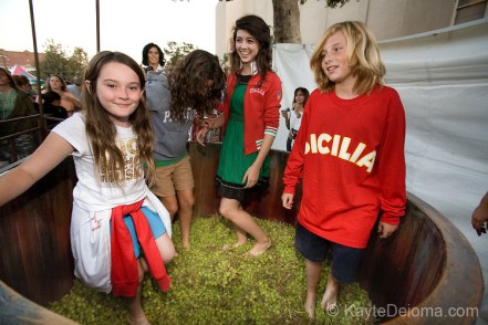 Kids try their feet at grape stomping at the Italian Feast of San Gennaro - Los Angeles, CA