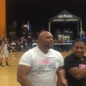 Divas in Defense co-founders, Cole and Chris Britto, cracking up after celebrity player starts dancing at at the freethrow line (photo credit: Rochelle Robinson)